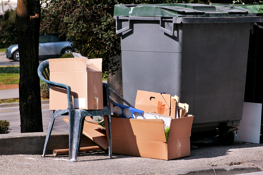 Waste Left Next To Trash Dumpster On The Street. Cardboard Boxes estate trash