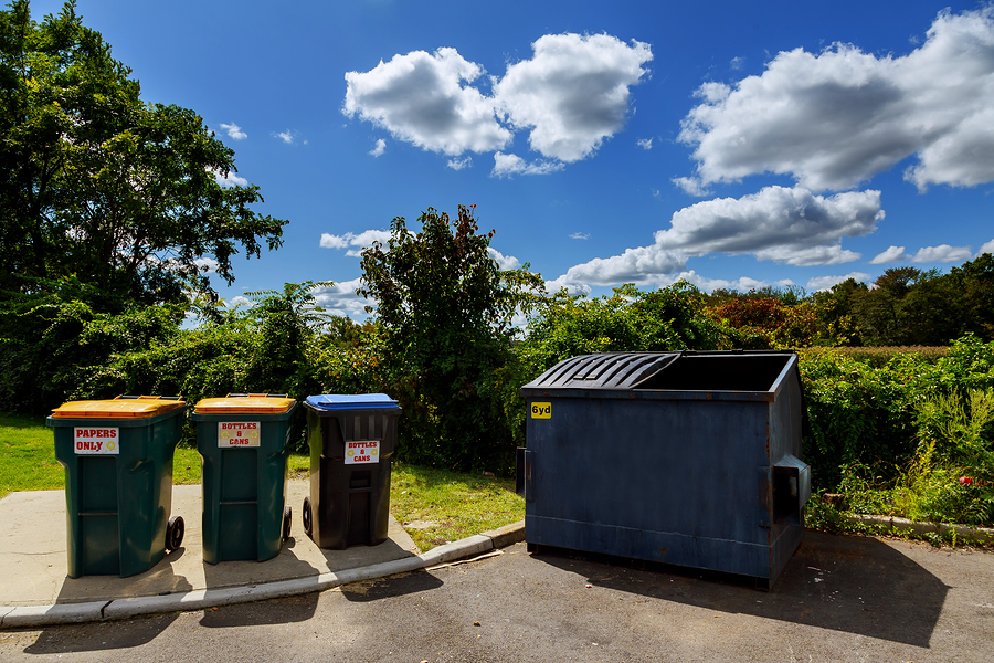 Dumpsters being full with garbage Dumpsters being